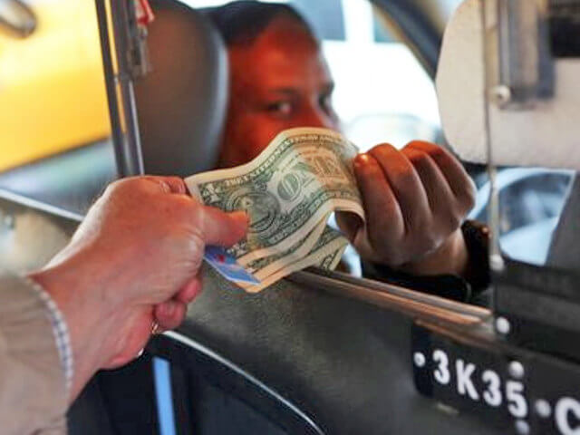 Taxi accepting a tip